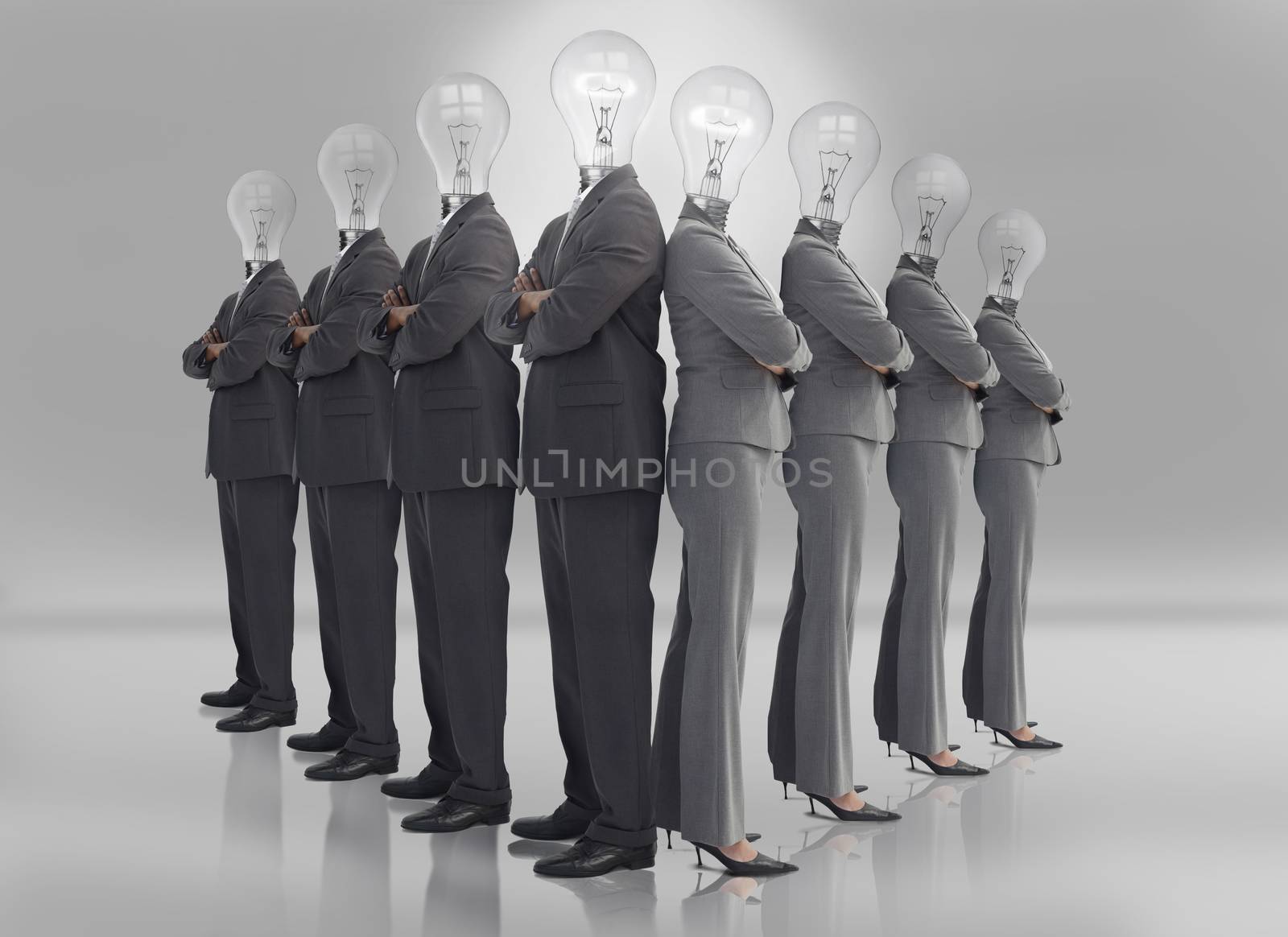 Business team with light bulb heads on grey background