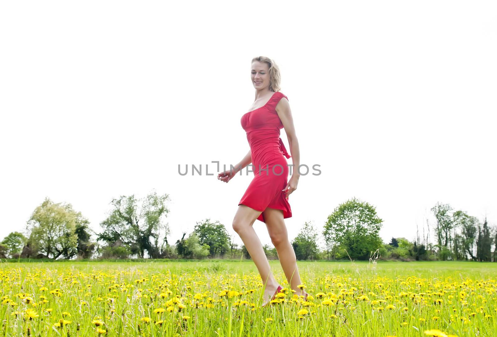 happy young woman on a meadow