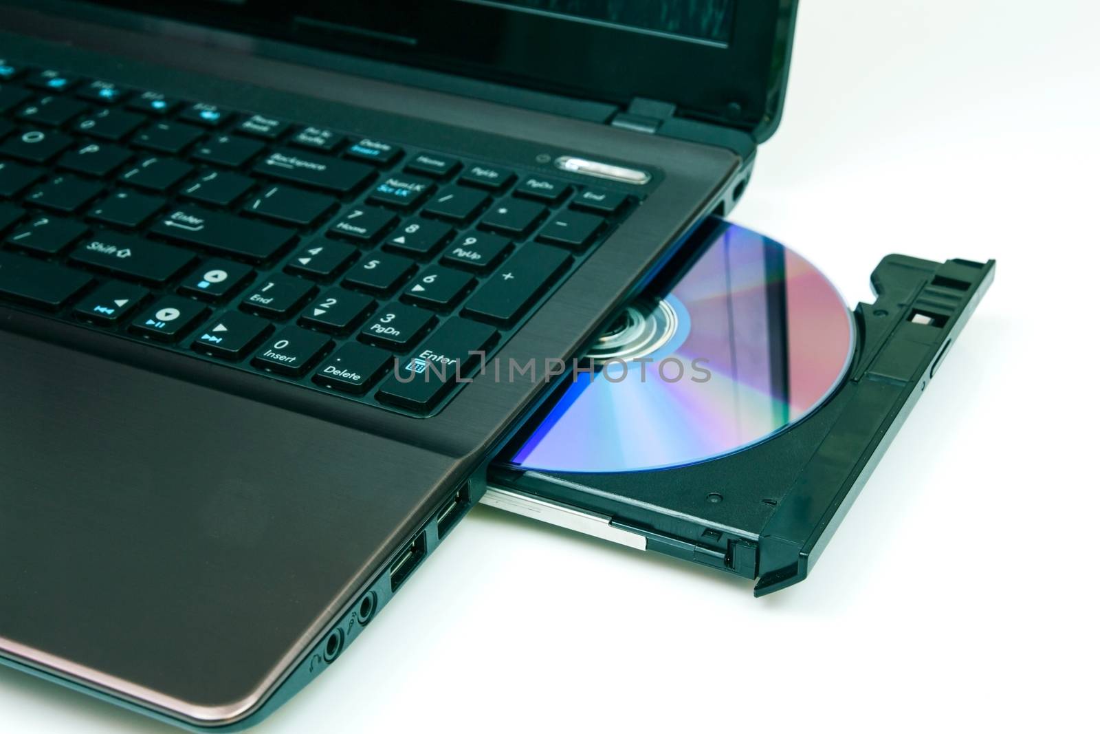 Laptop with open CD or DVD-ROM  by simpson33