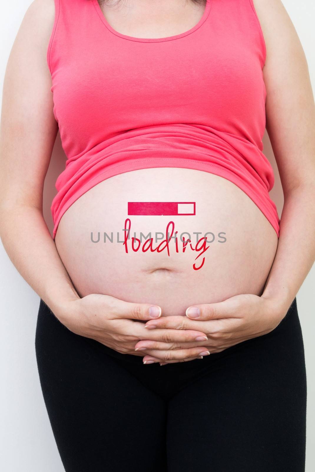 Pregnant woman with loading concept painted on her belly