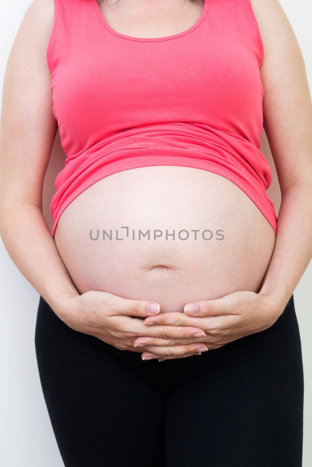 Young pregnant woman on white background by simpson33