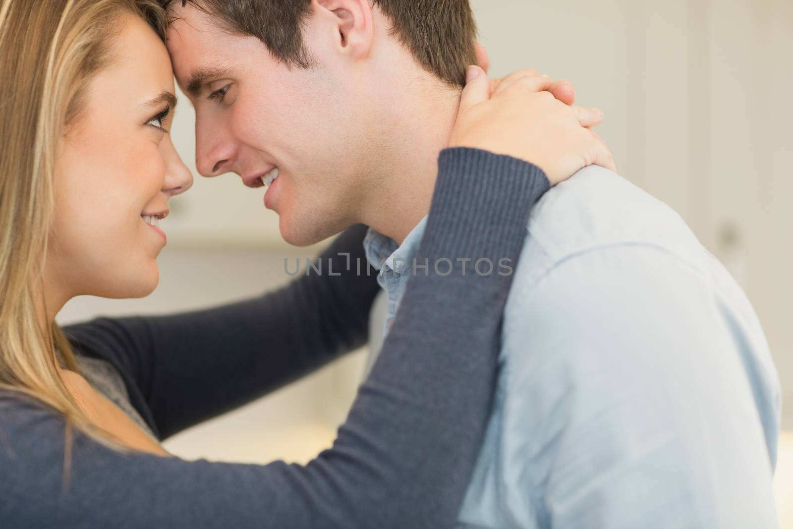 Woman and man looking into each others eyes lovingly
