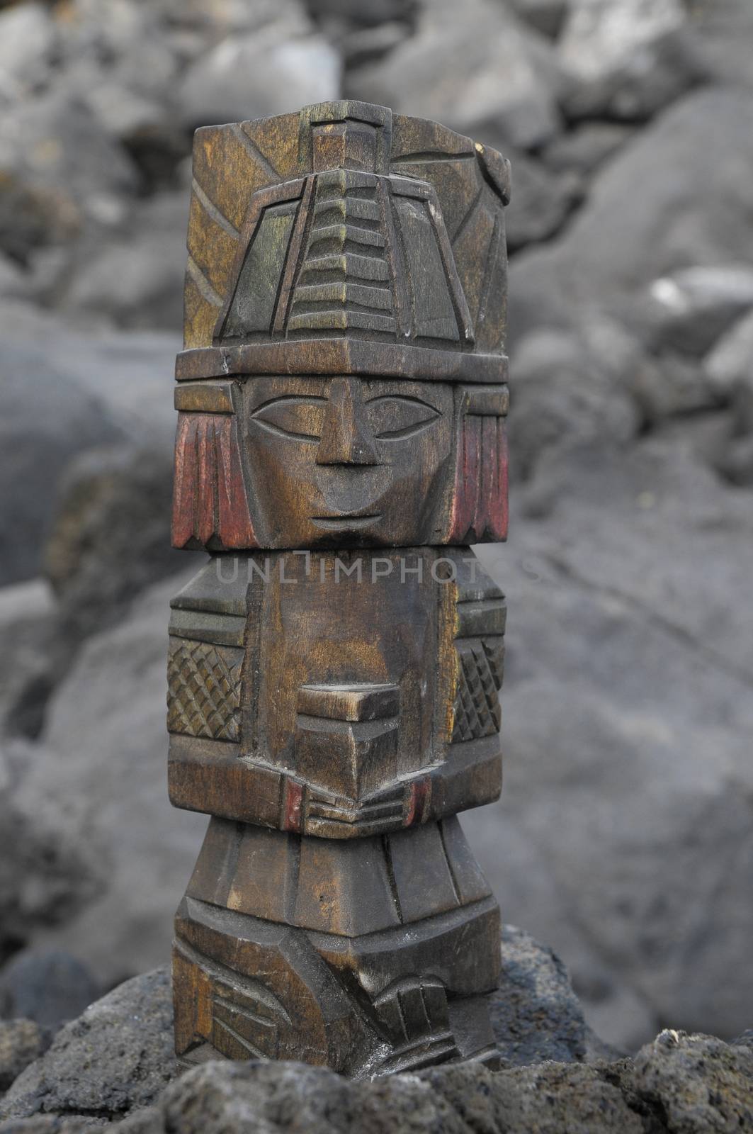 Ancient Maya Statue on the Rocks near the Ocean