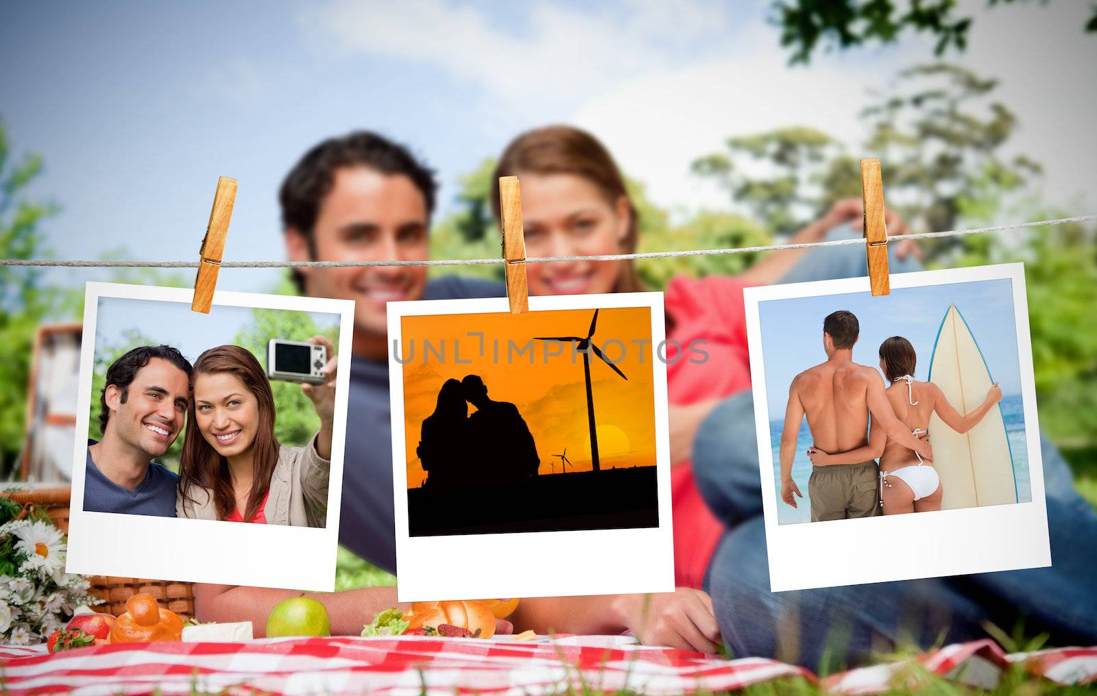 Serial instant photos of holiday scenes hung with a peg on a laundry line with couple having a picnic on the background