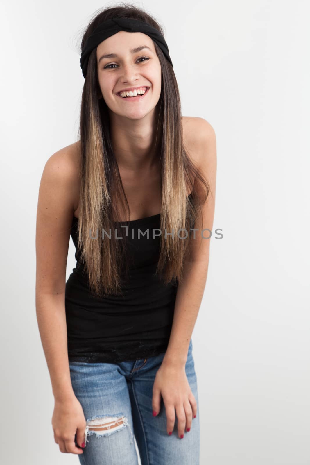 Young woman posing in front a white background by Izaphoto