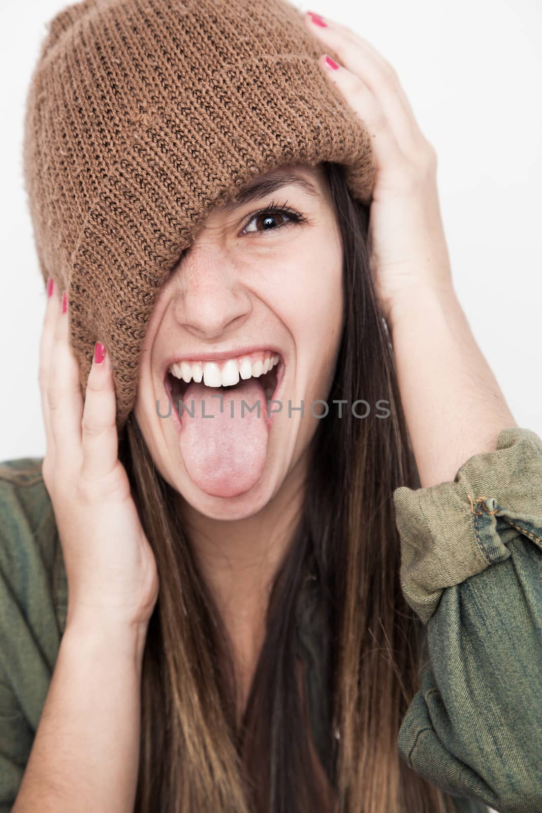 Young woman smiling face with brown hat by Izaphoto