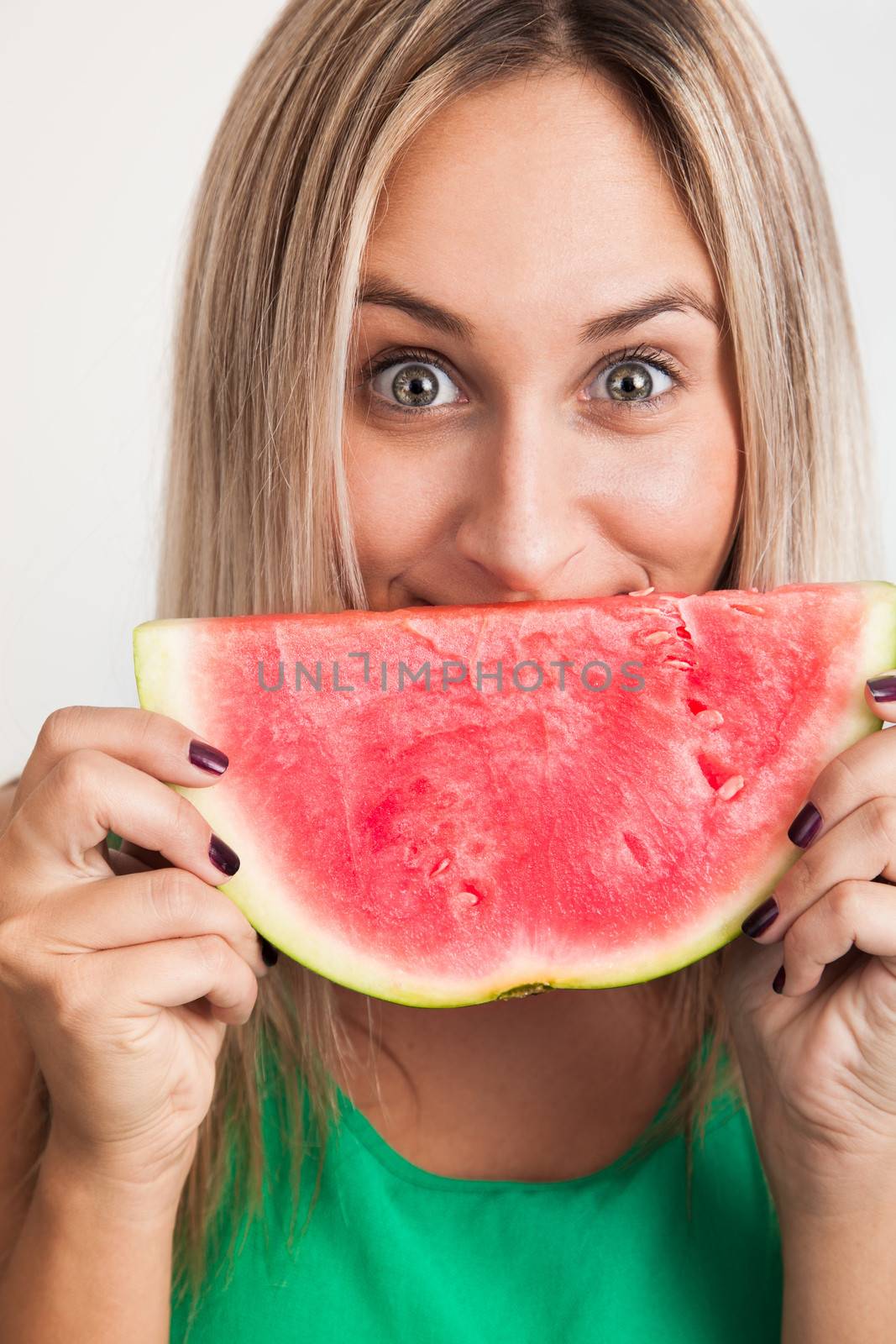 Cheerful Blond young Woman Holding Watermelon