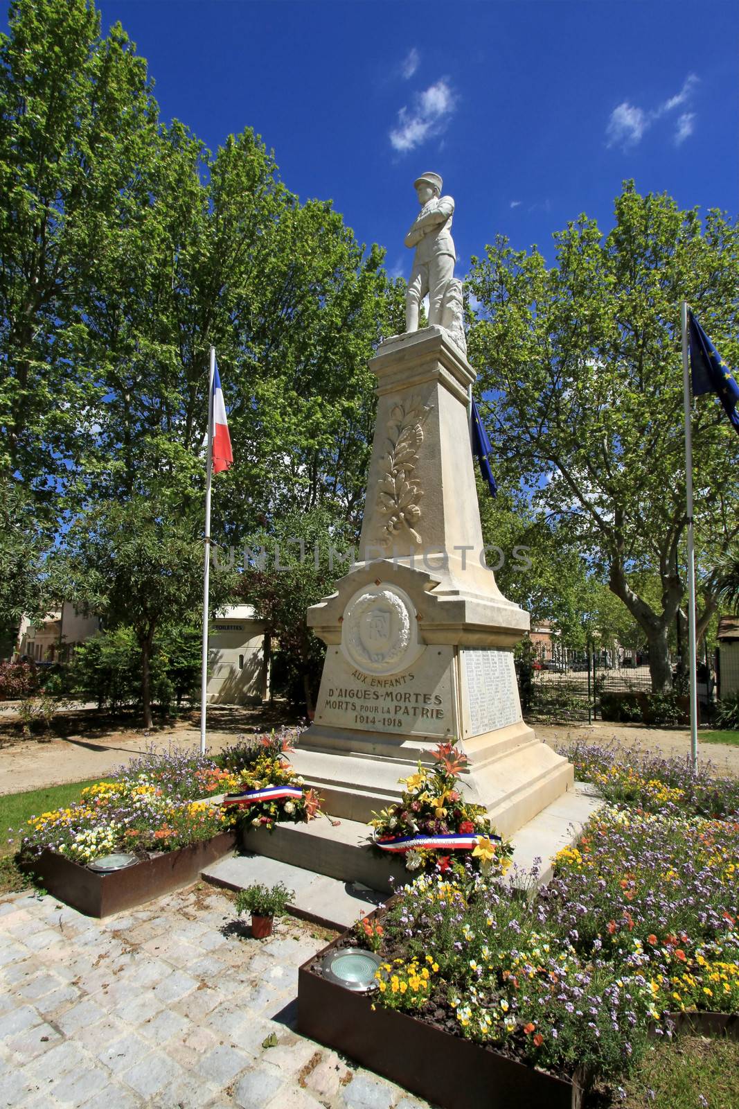 Memorial for WW1 dead people in a garden by beautiful weather, Aigues-Mortes, France
