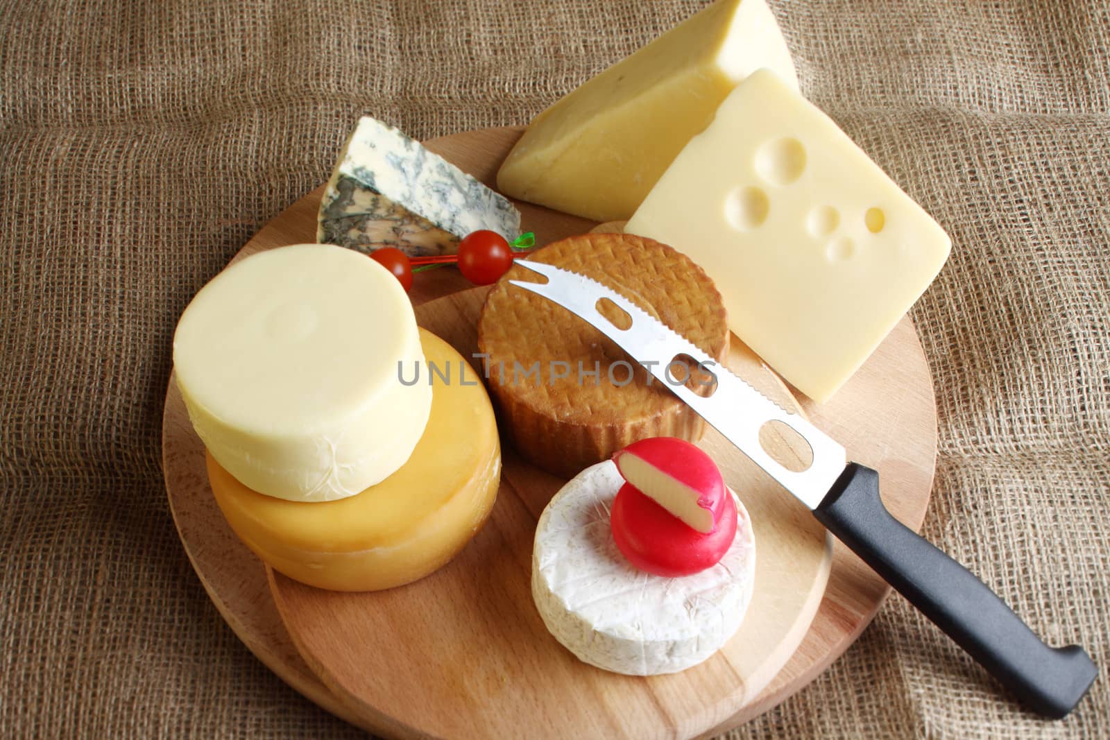 Several types of cheese and knife close up