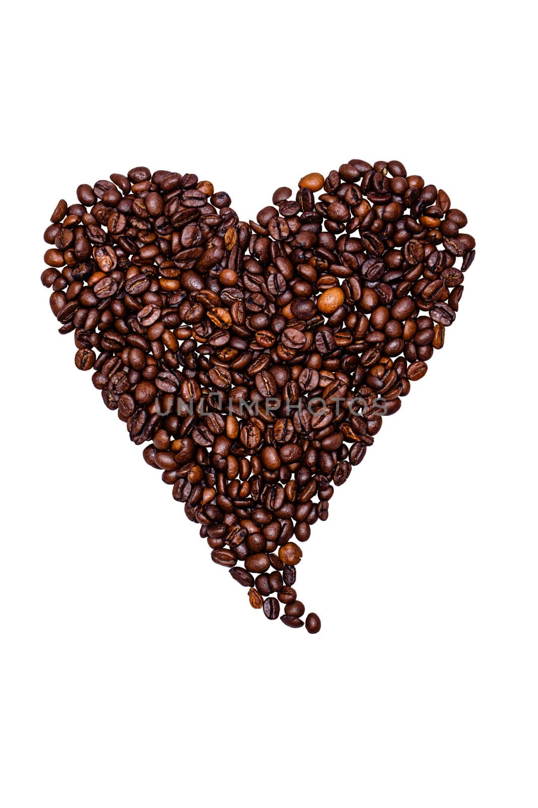 Coffee beans laid out a heart isolated on white background