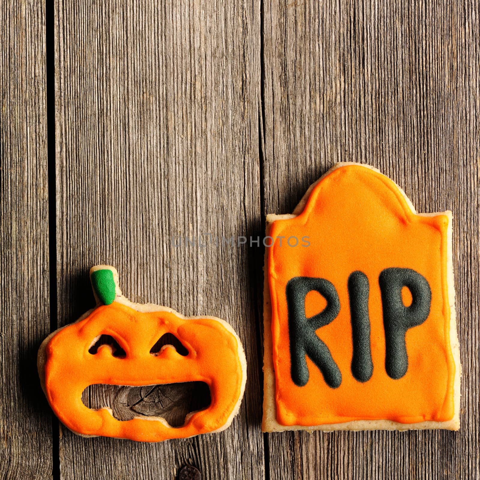 Halloween homemade gingerbread cookies over wooden table