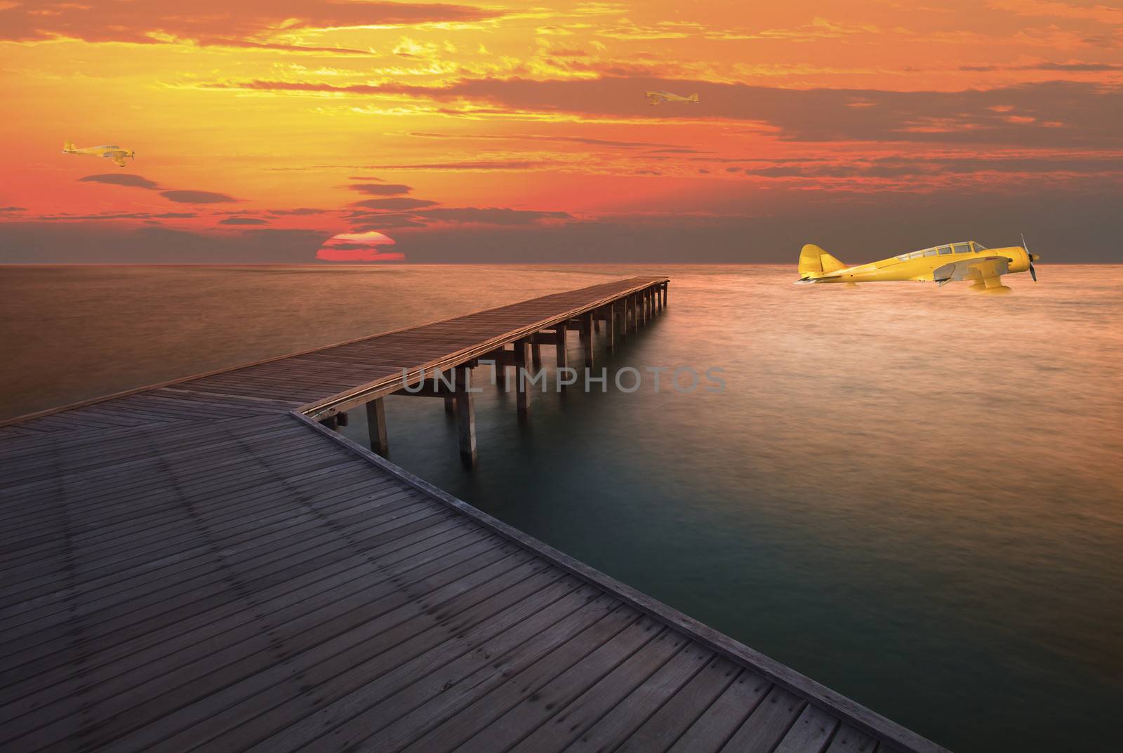 old sea plane floating on sea water by khunaspix