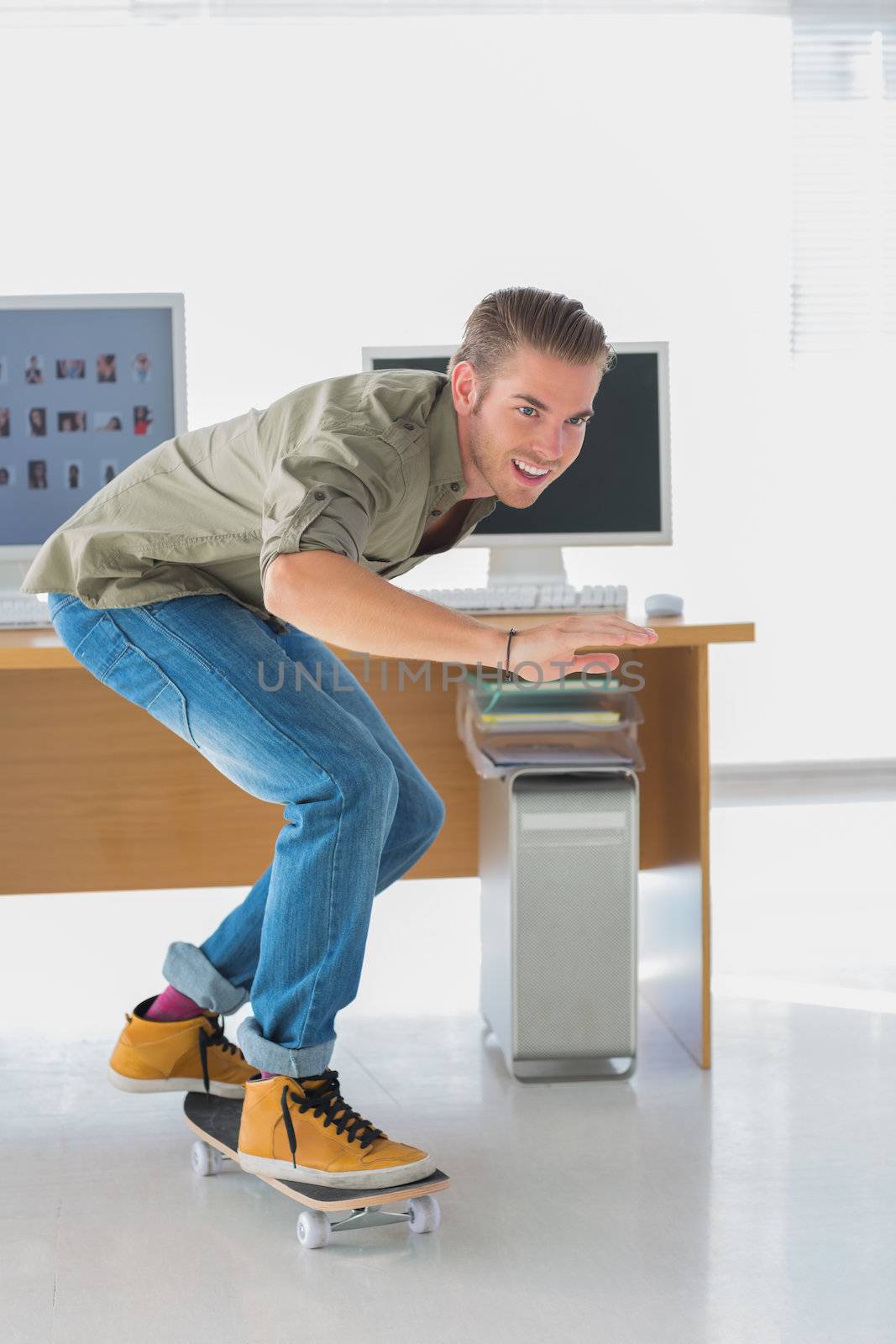 Creative business employee skating through the office and having fun