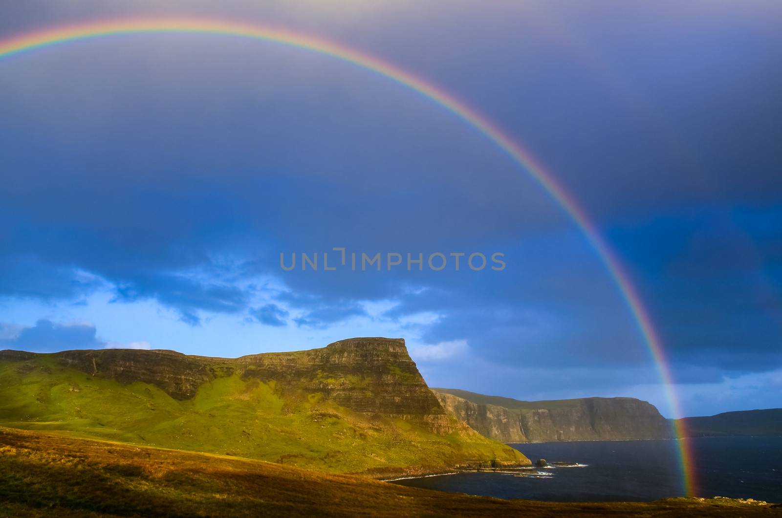 Rainbow over a dramatic coast of Scottish highlands, Isle of Sky by martinm303