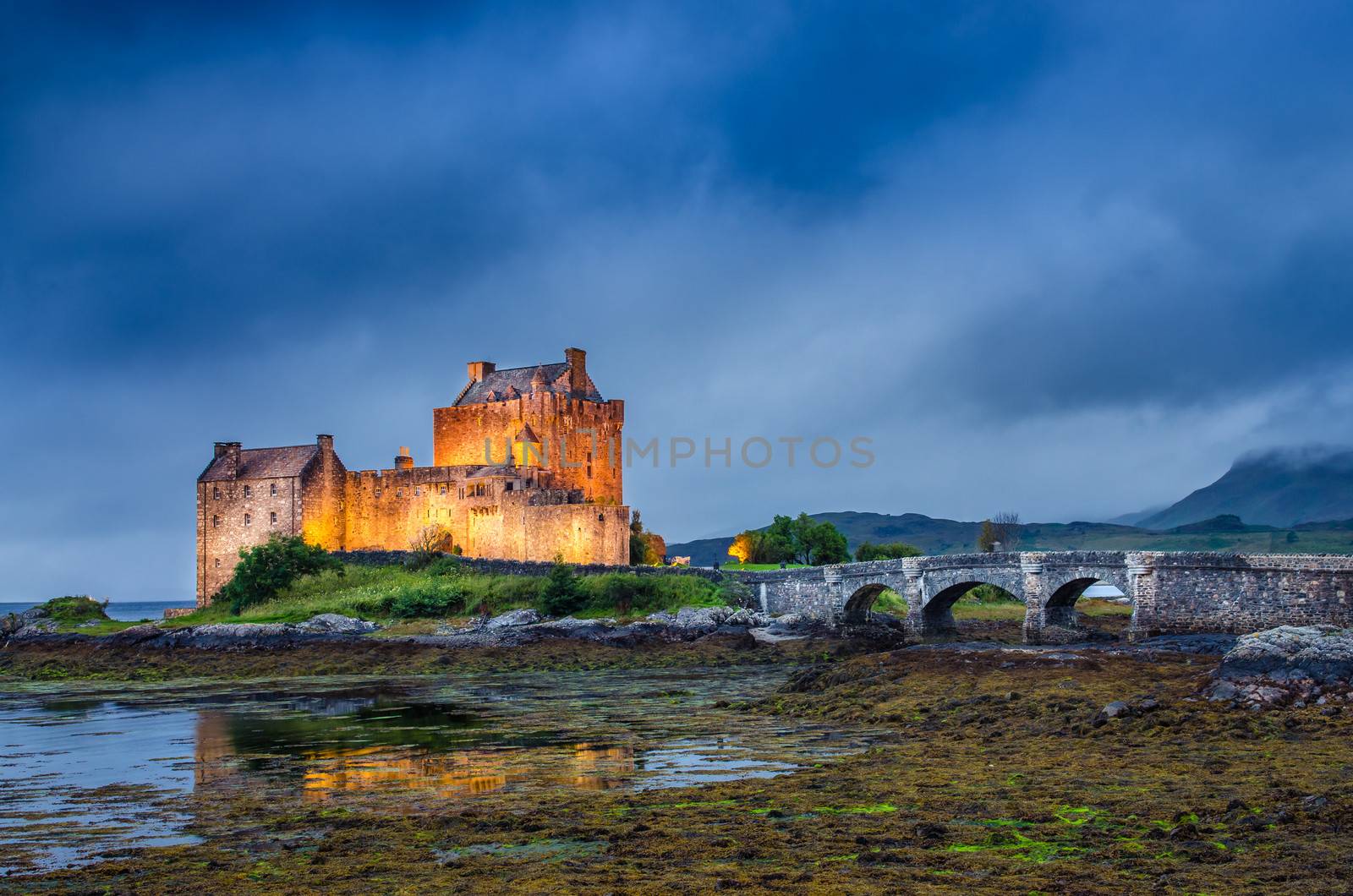 View of Eilean Donan castle at sunset, Scotland, United Kingdom