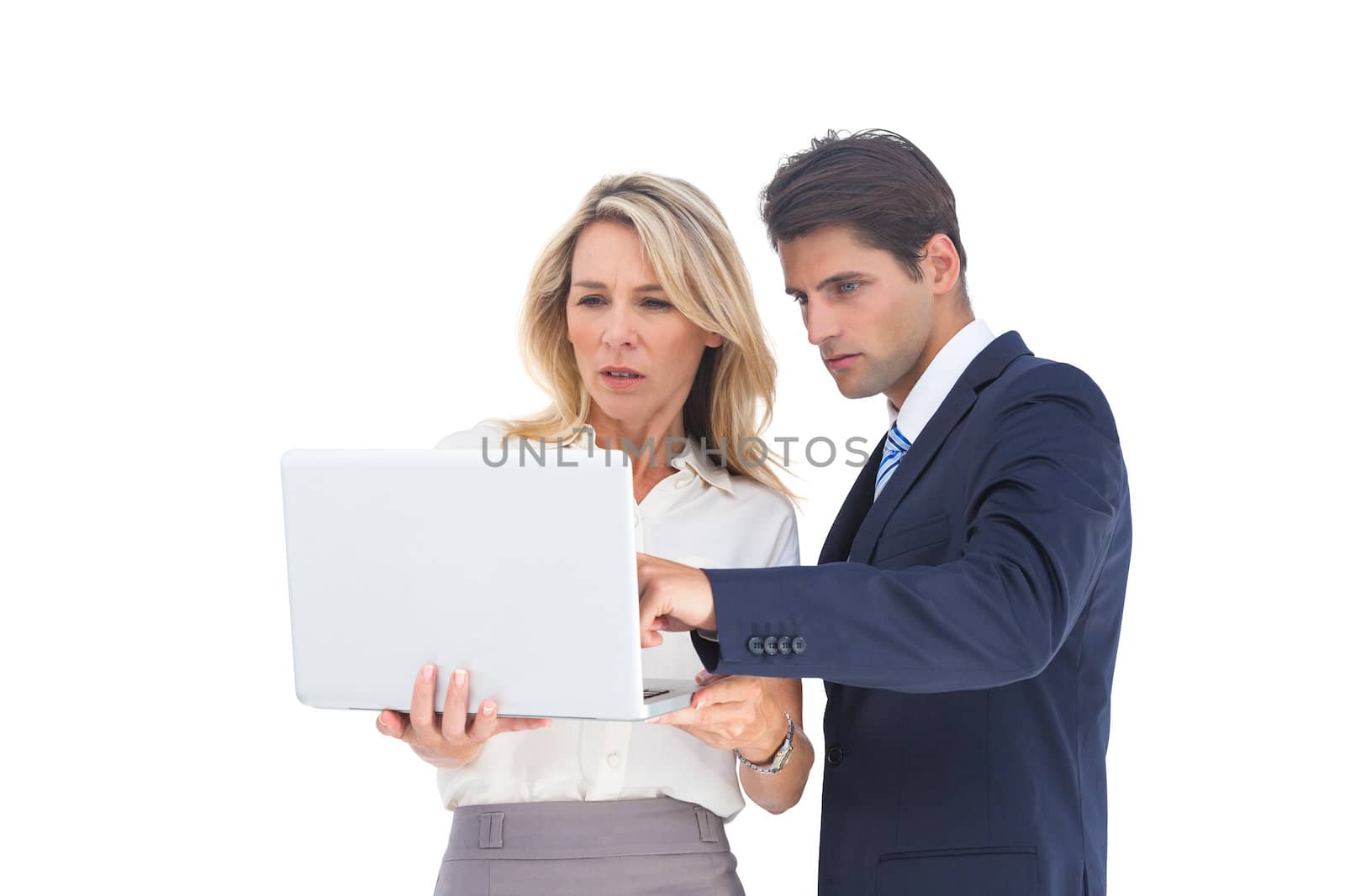 Business people looking at a laptop by Wavebreakmedia