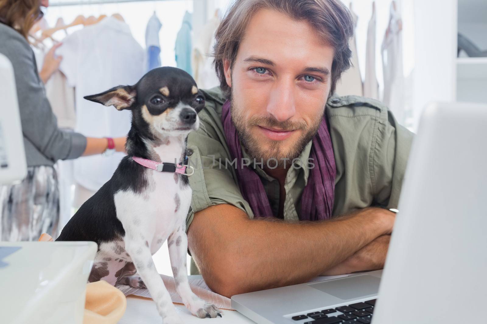 Fashion designer with his chihuahua by Wavebreakmedia