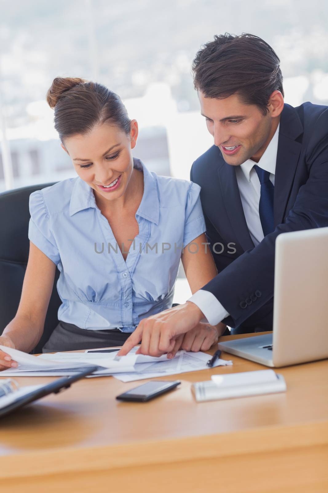 Business people working together and smiling in the office 