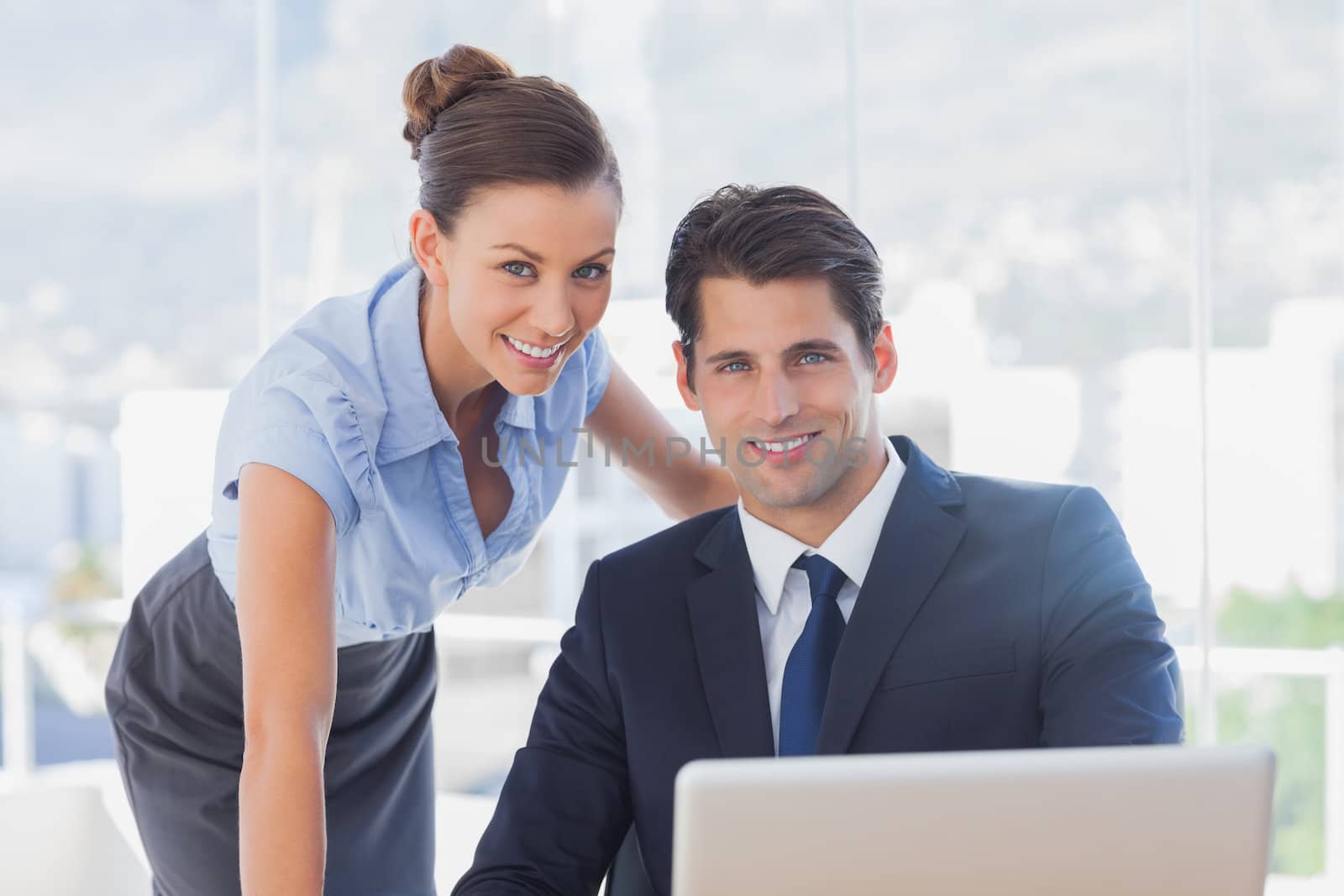 Business people smiling together in the office 