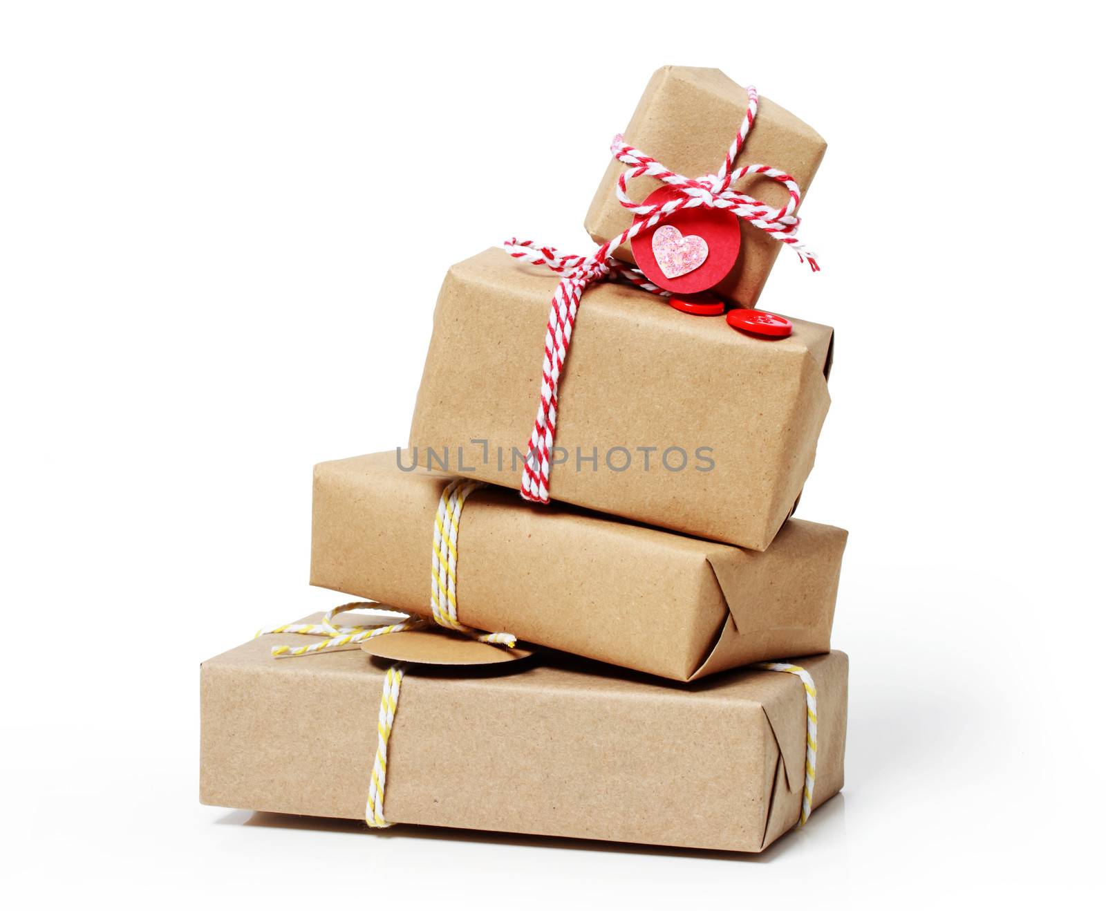 Stack of handcraft gift boxes on white background