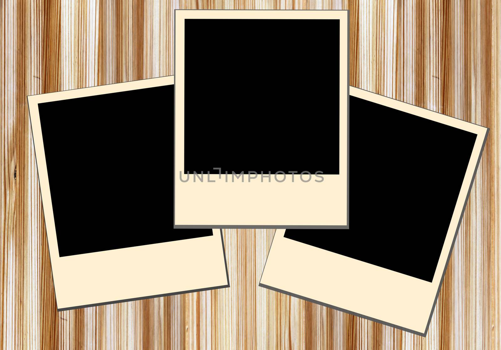 Blank old picture frames  on wooden background