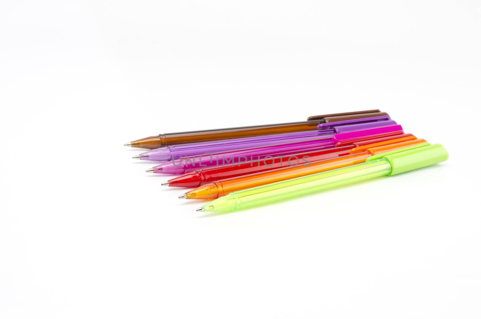 colorful pens isolated on white by ammza12