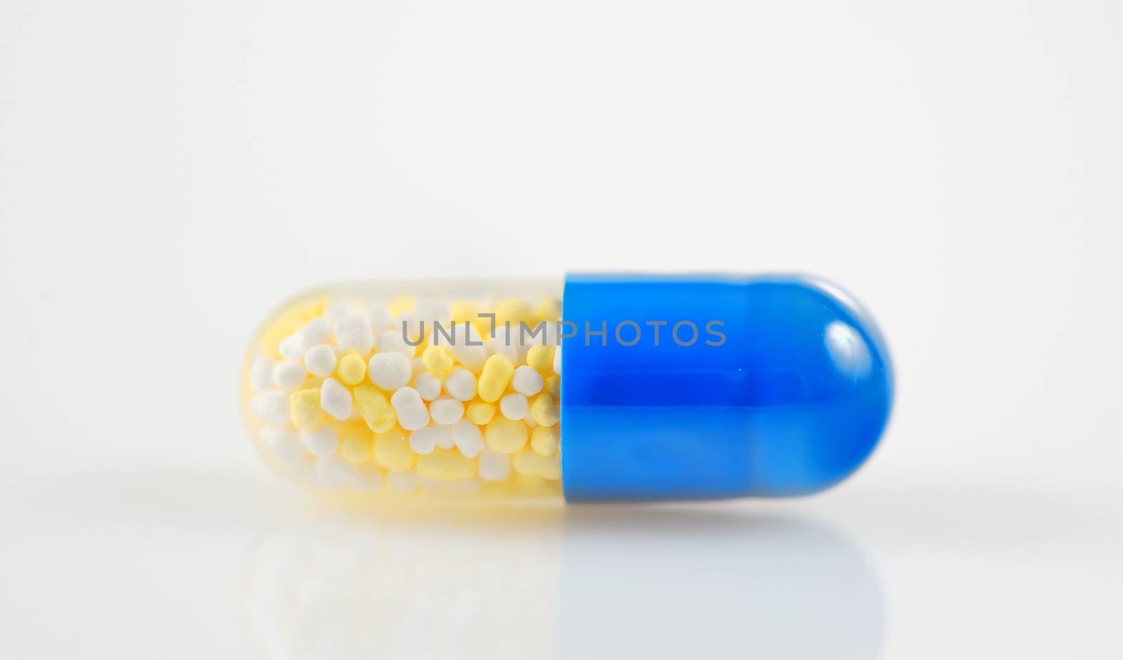 Medical pill tablet isolated on white, in two colors
