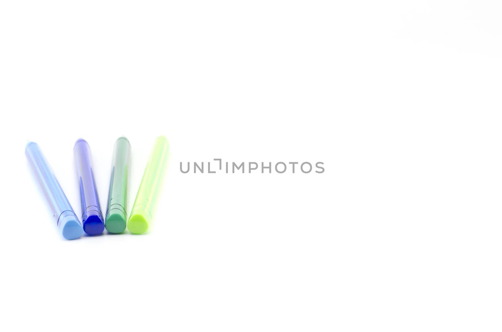 colorful pens isolated on white by ammza12