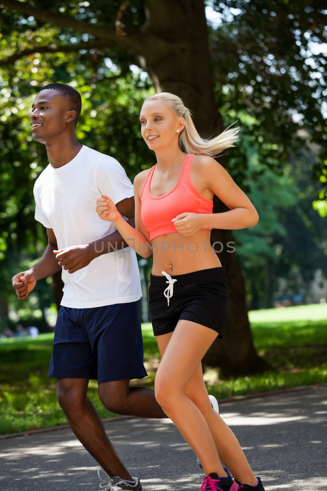 young couple runner jogger in park outdoor summer by juniart