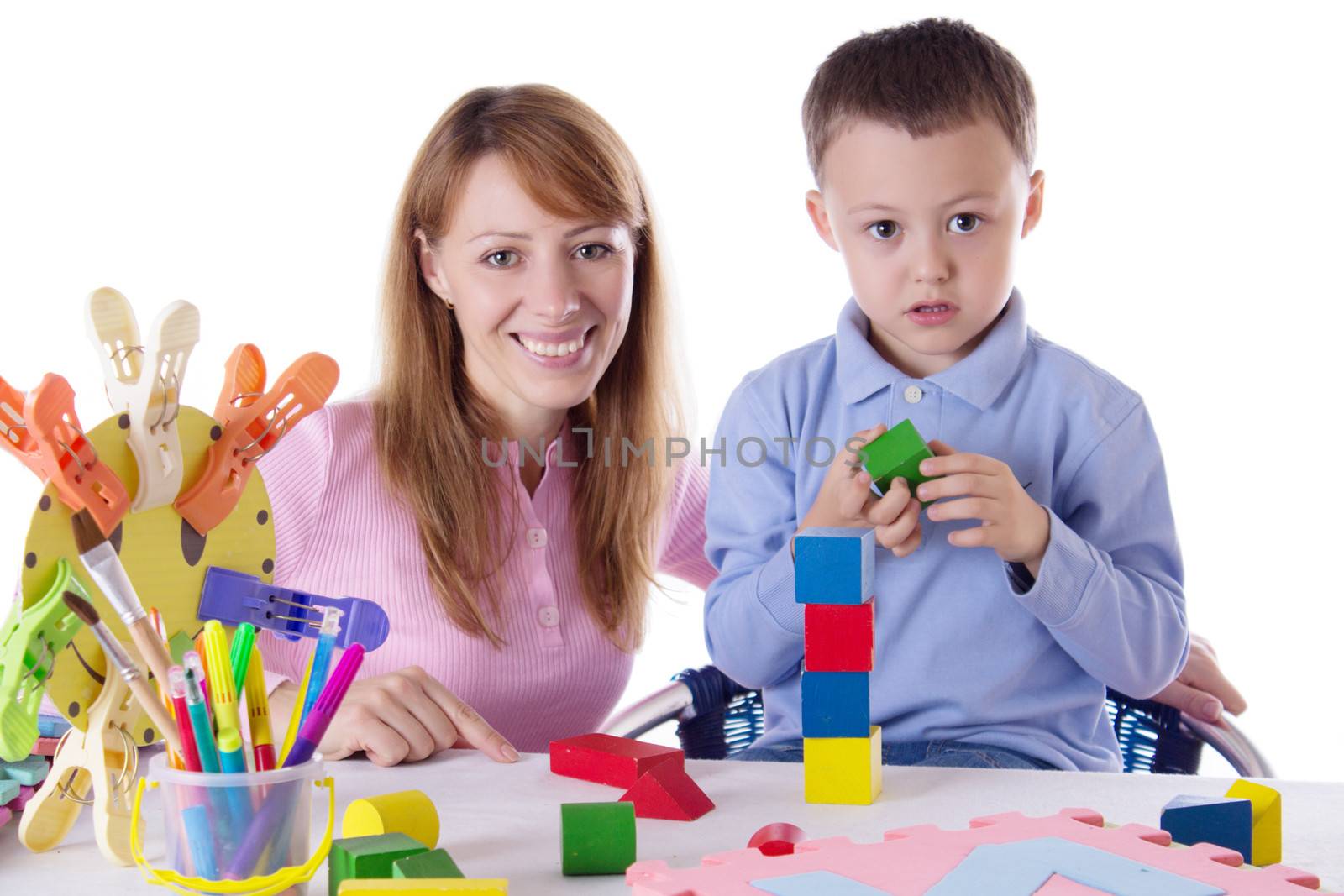 Mother and son playing with cubes isolated on white