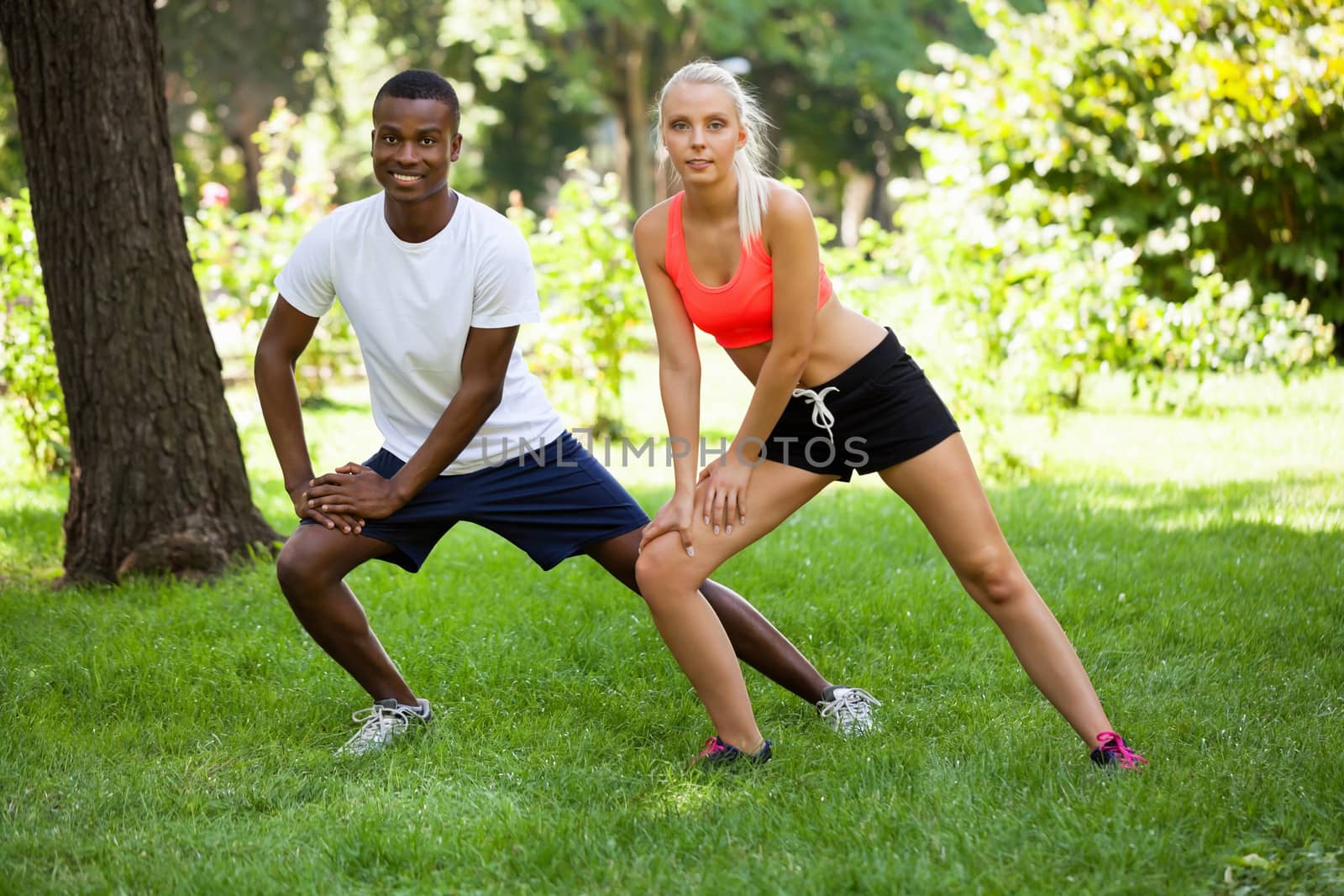 young couple runner jogger in park outdoor summer sport lifestyle 