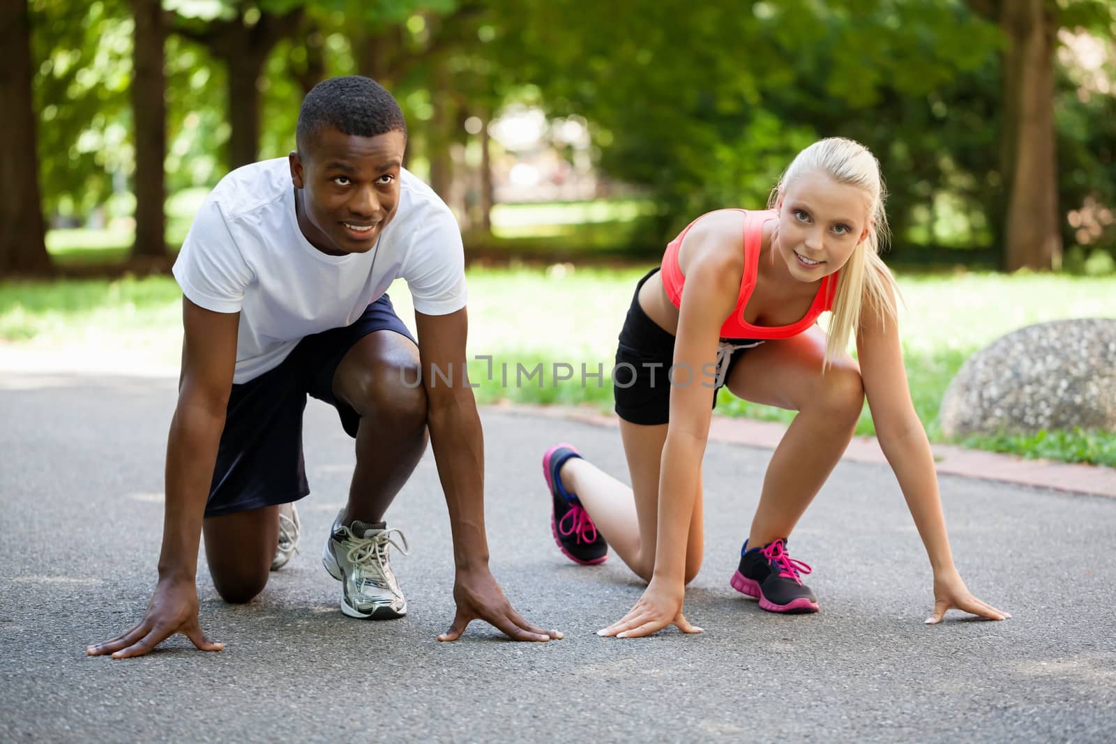 young couple runner jogger in park outdoor summer sport lifestyle 