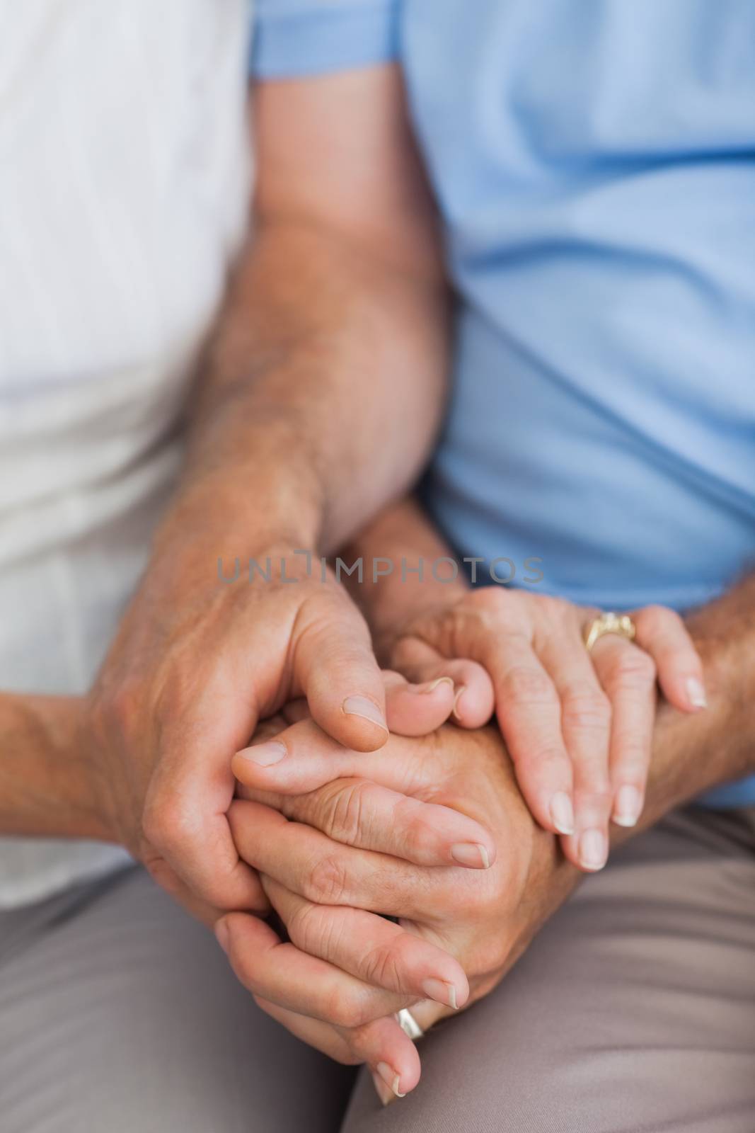 Close up of couple holding hands