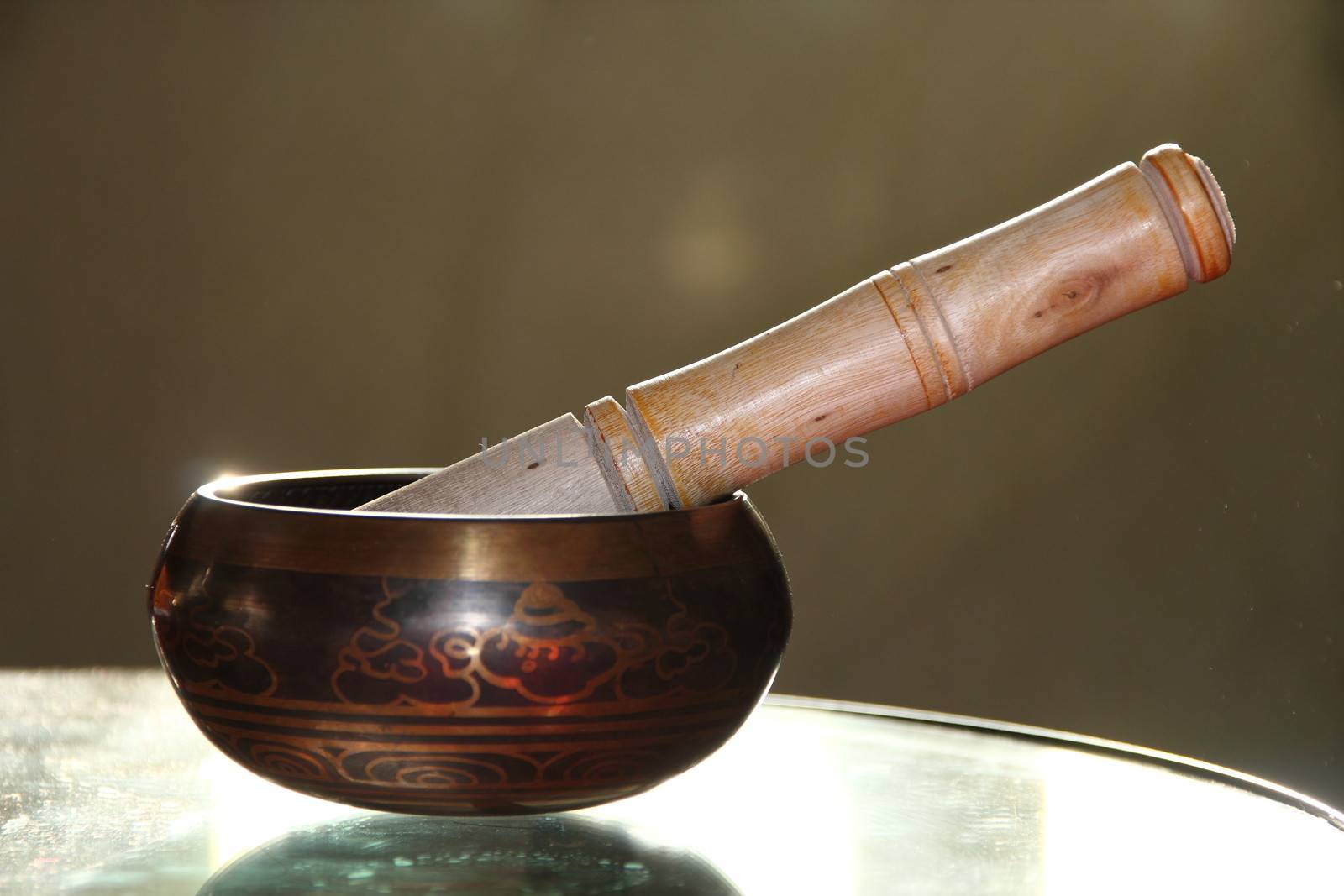 Tibetan singing bowl with a wooden stick