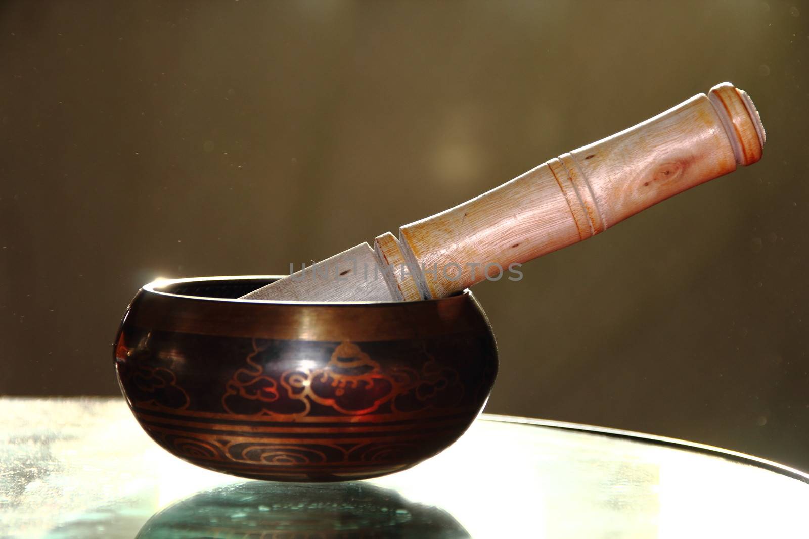 Tibetan singing bowl with a wooden stick