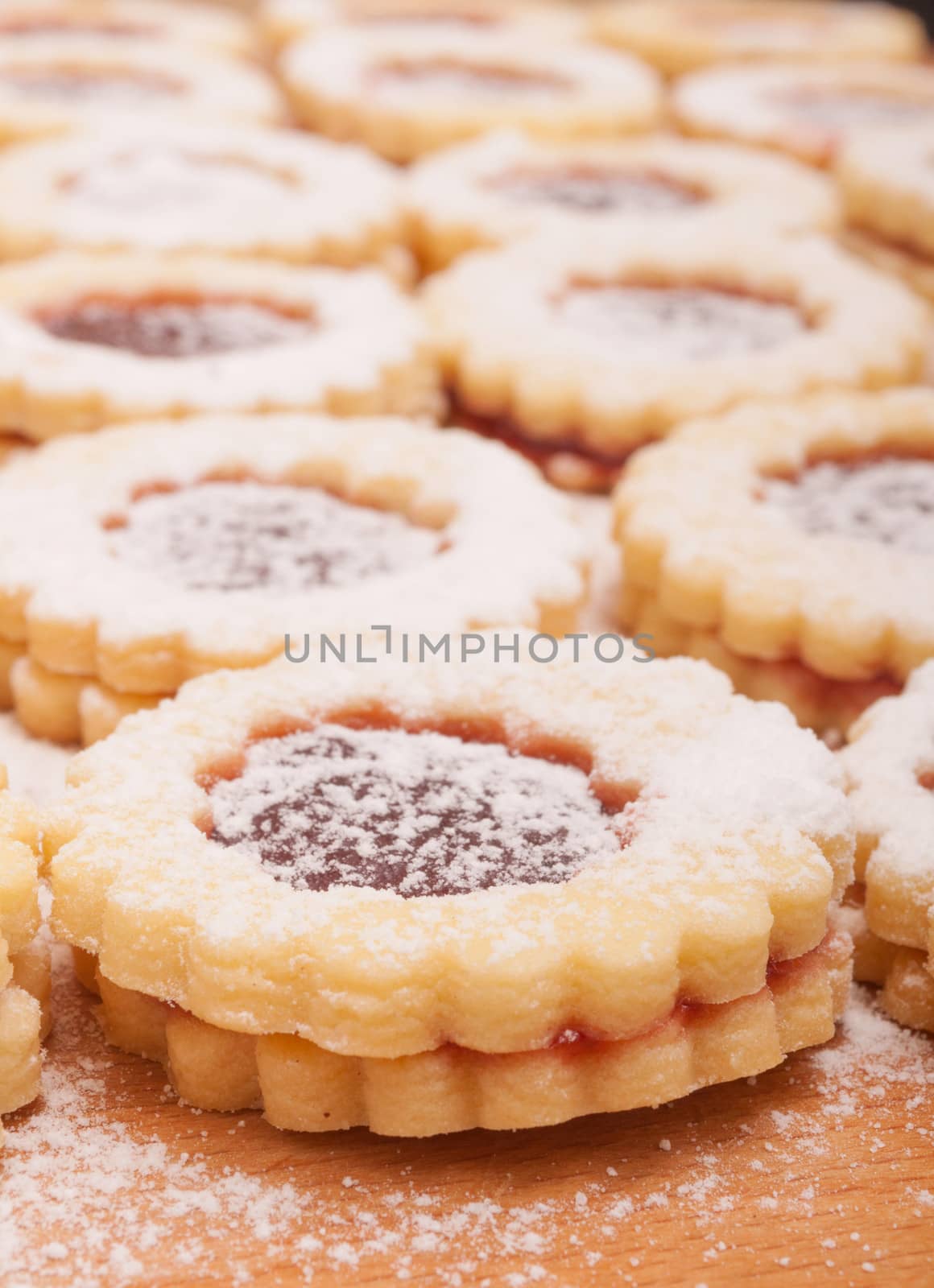 Closeup of Traditional Linzer Cookies on Wooden Board