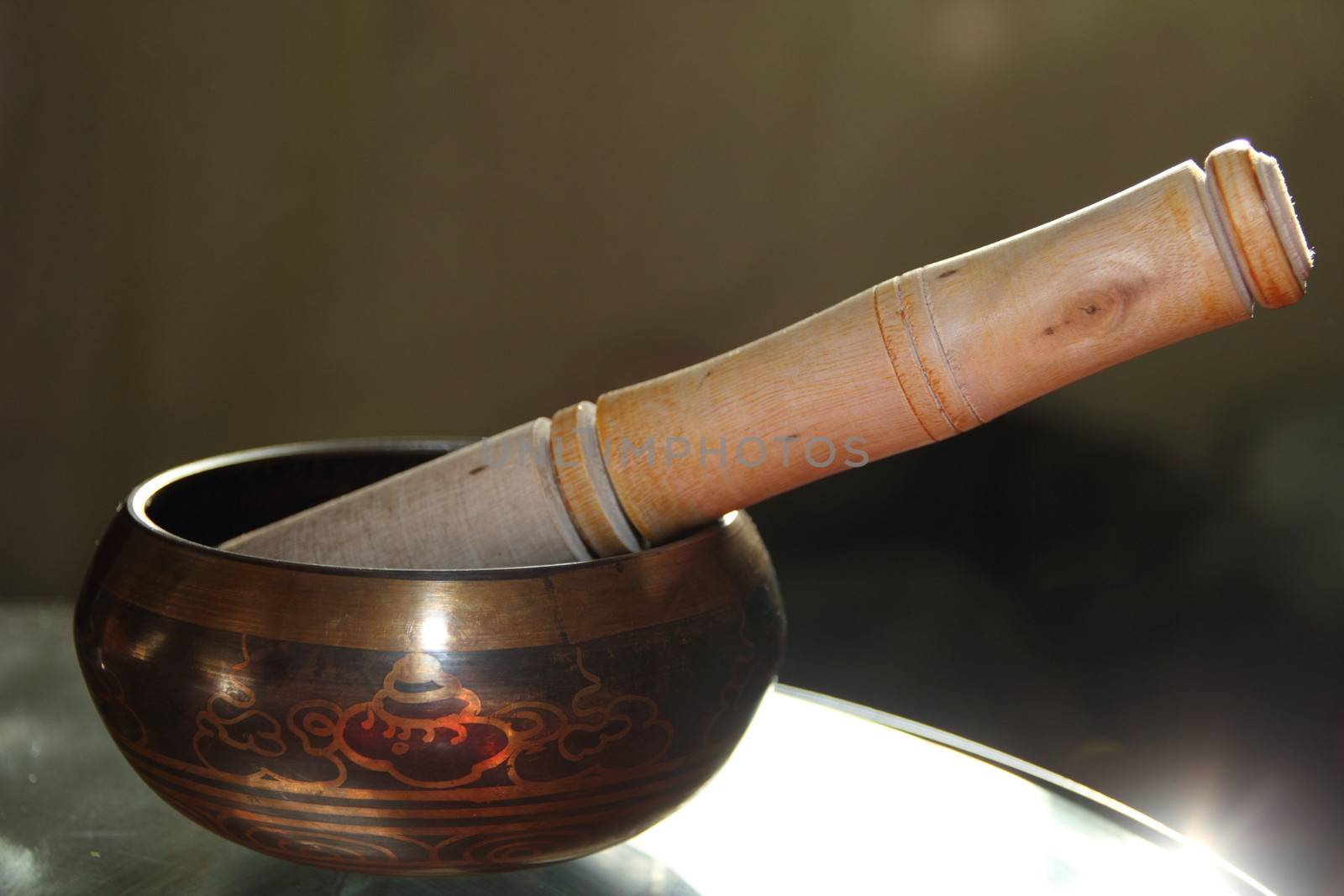 Tibetan singing bowl with a wooden stick