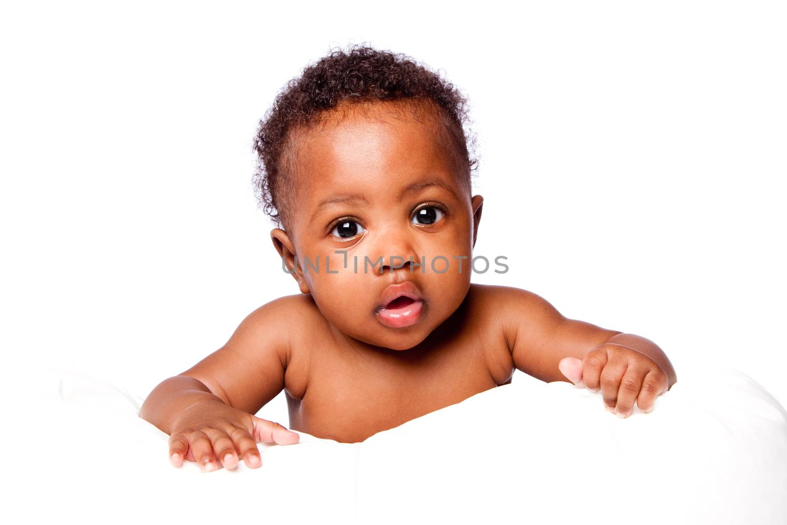 Adorable cute African infant baby face with curly hair, on white.