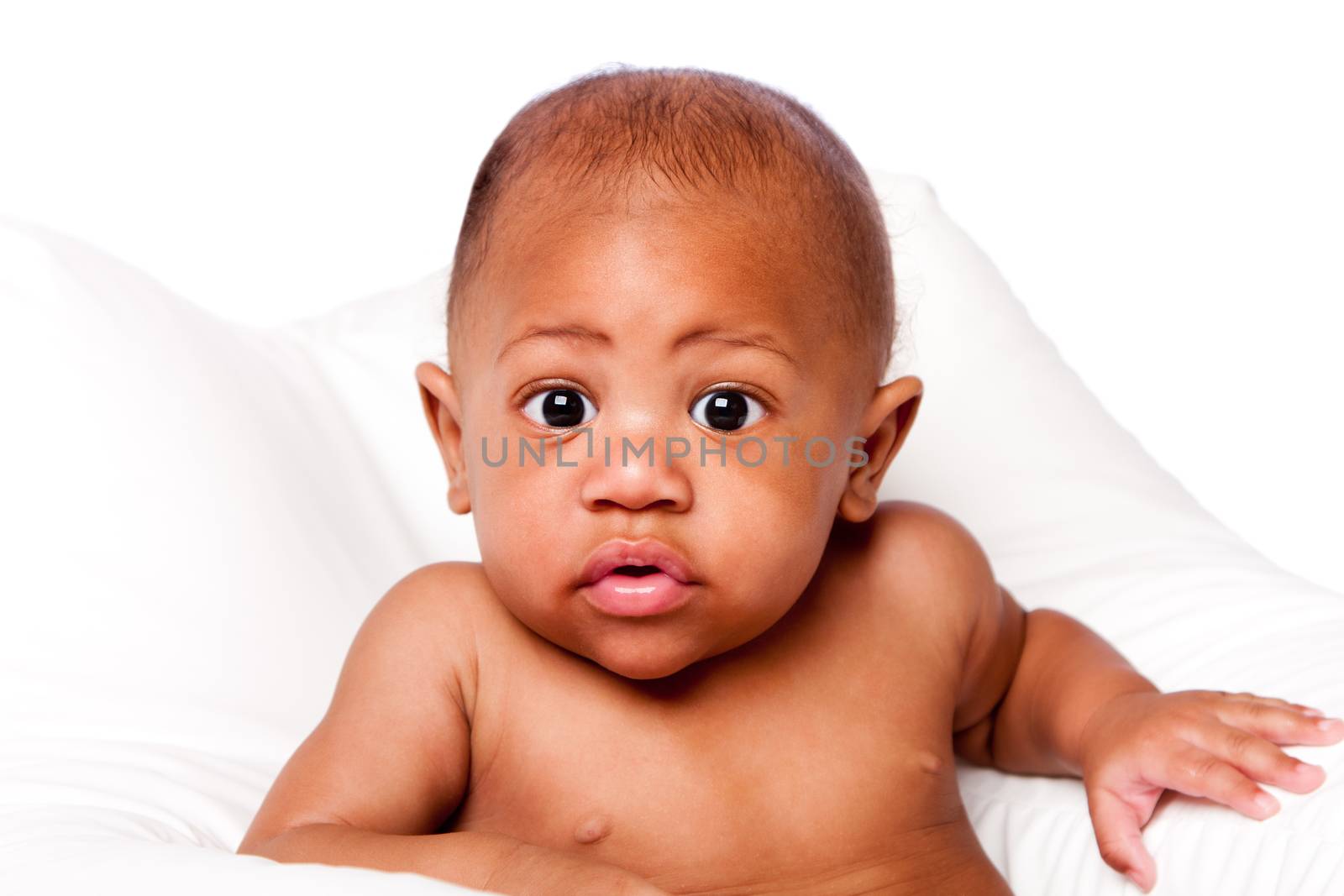 Cute beautiful adorable African baby face with huge eyes on white.