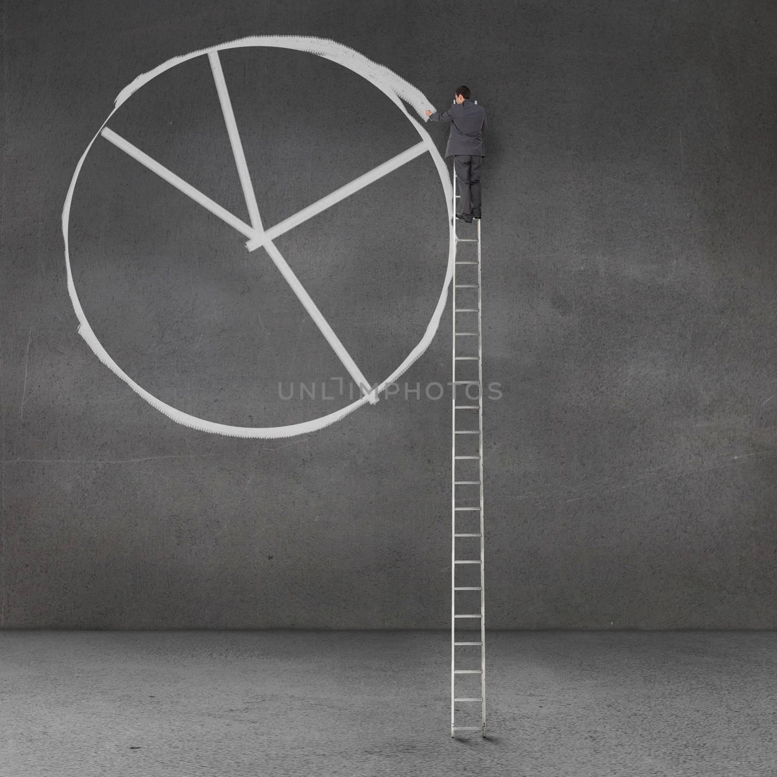 Businessman drawing a giant pie chart on a grey wall