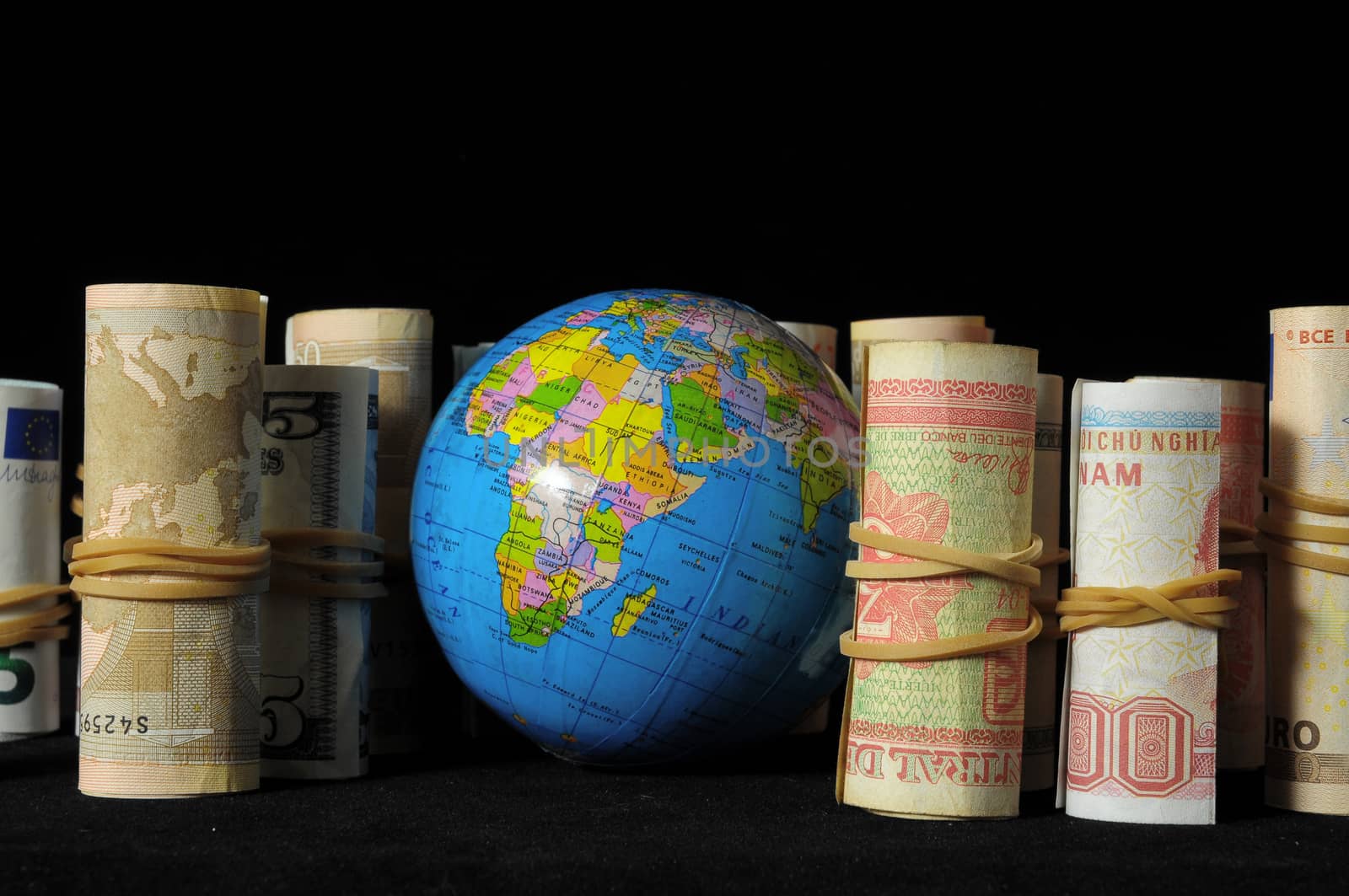 The Planet Earth and Rolled Money Financial Concept