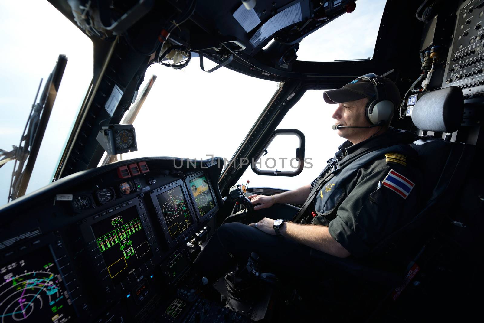 Offshore helicopter pilot in flight for oil rig operation