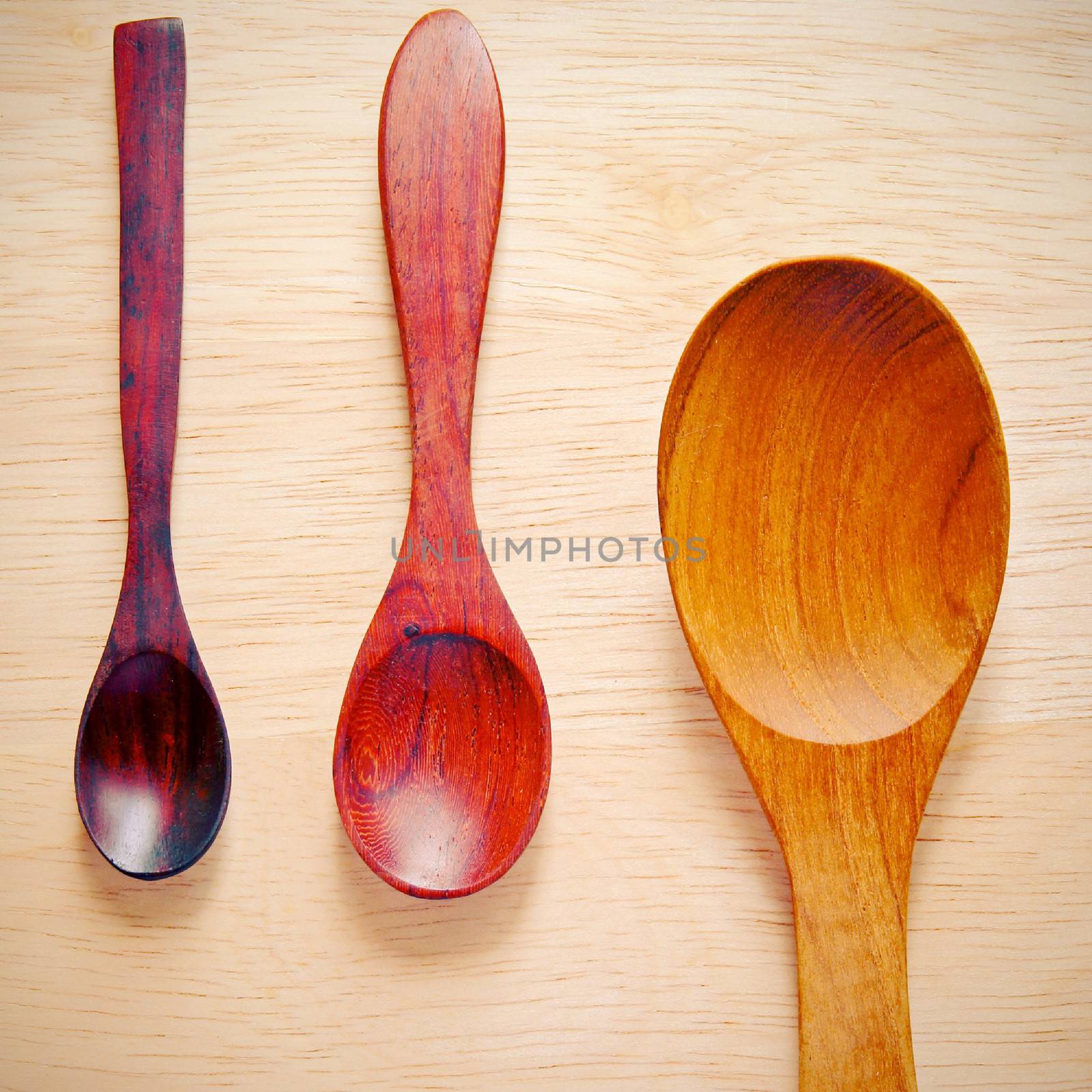Collection of wooden kitchen spoons with retro filter effect by nuchylee