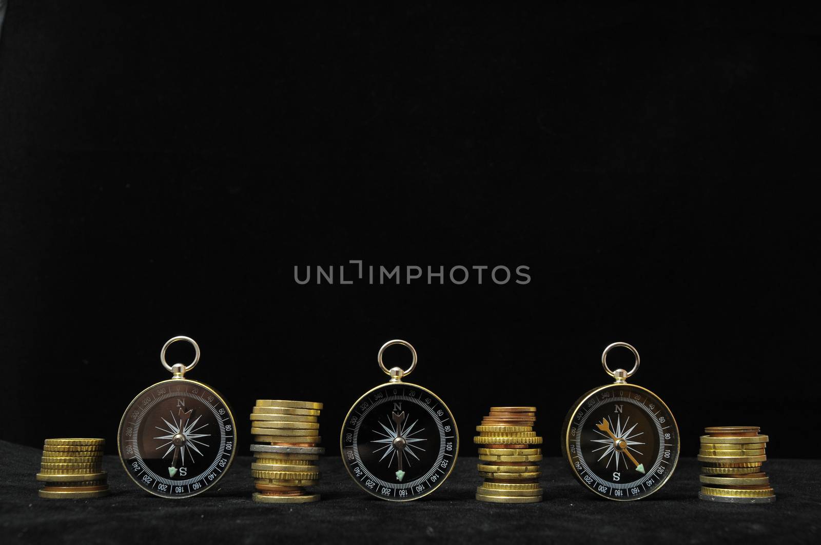 Orientation in  Business Compass and Money on a Black Background