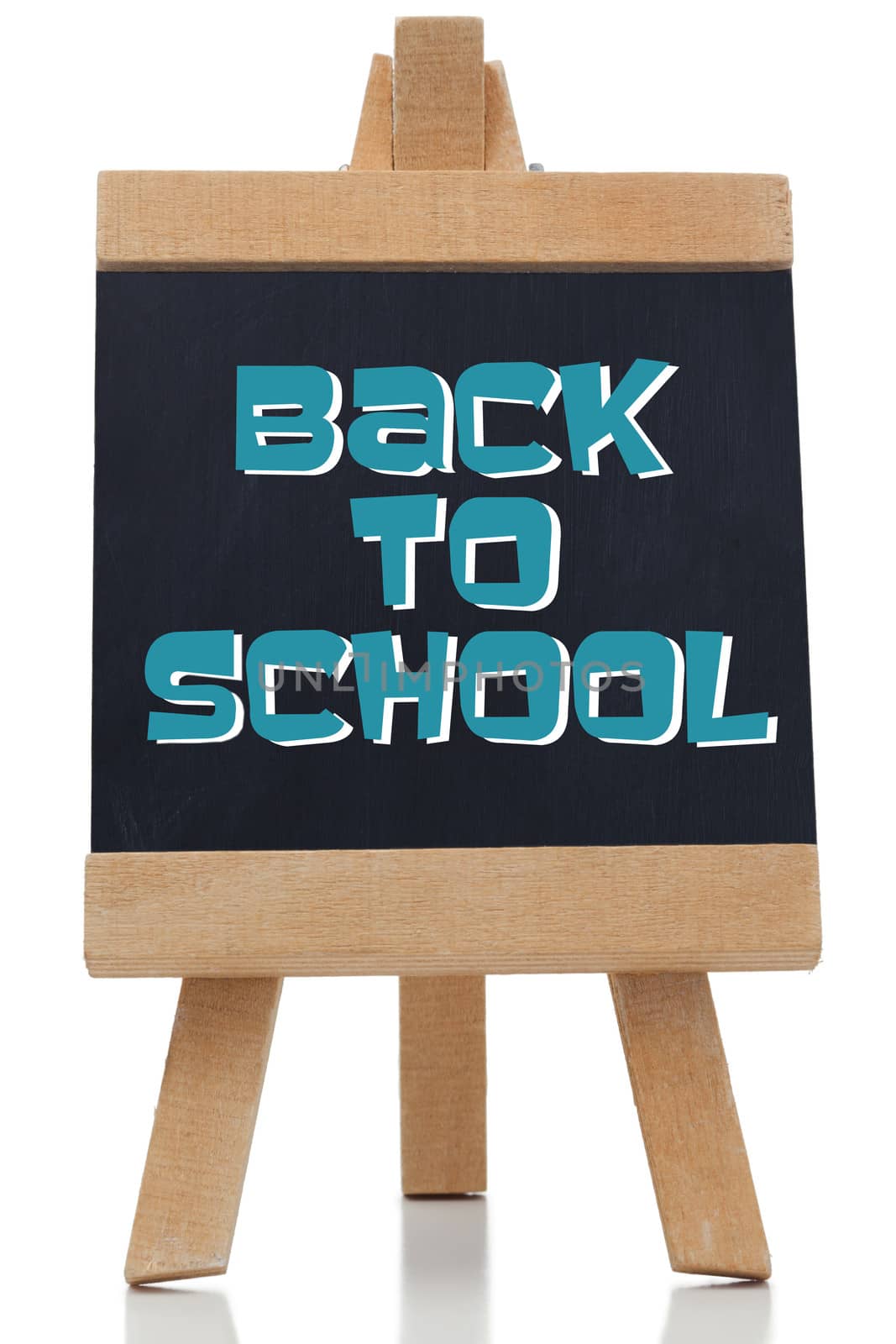 Back to school written in blue on chalkboard  by Wavebreakmedia