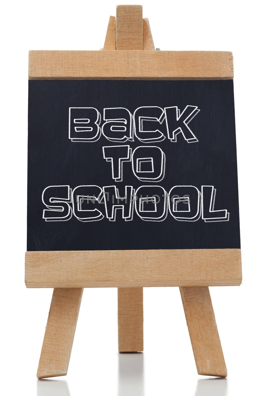 Back to school written in black on chalkboard against white background