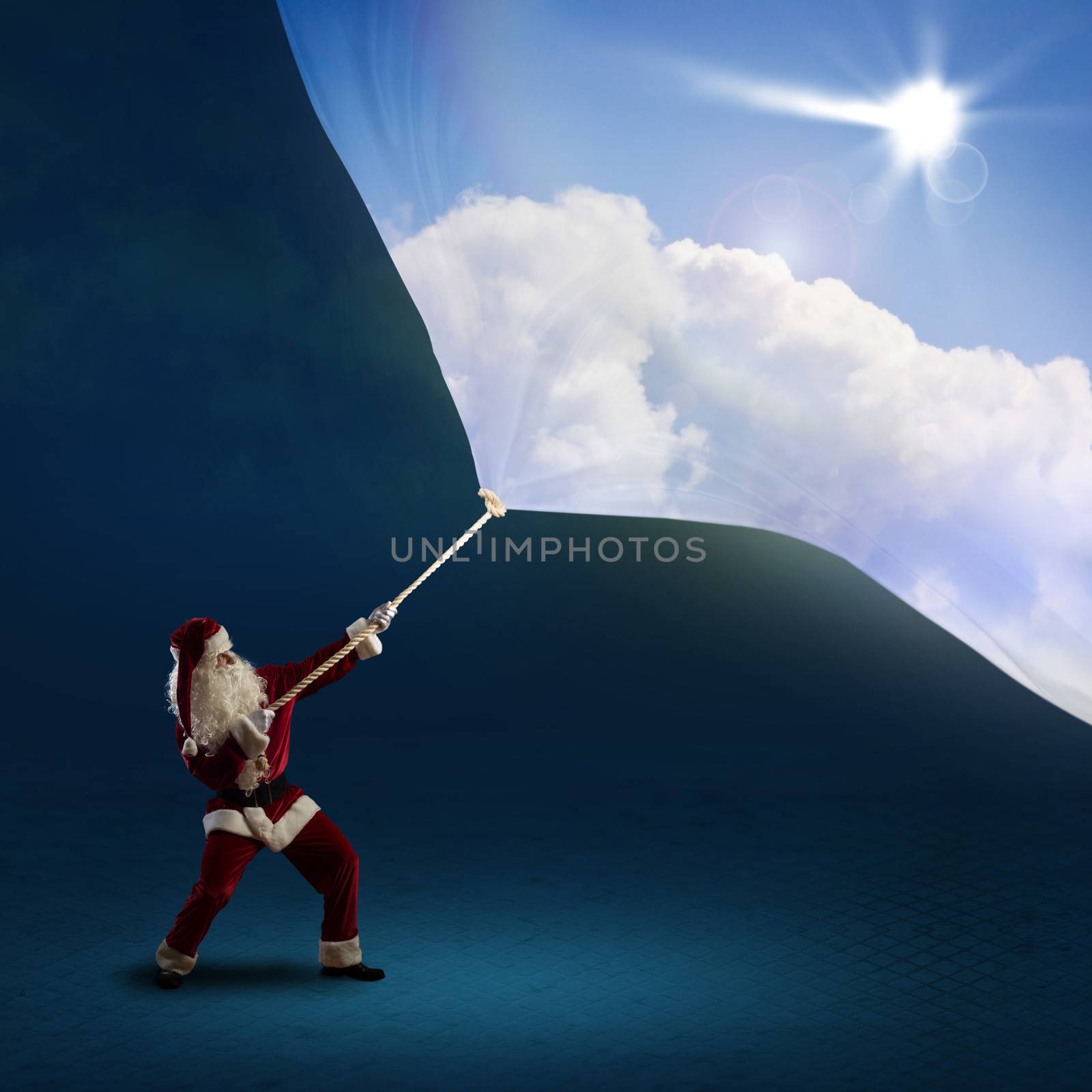 Santa Claus pulls a banner with day sky of cloth with a rope