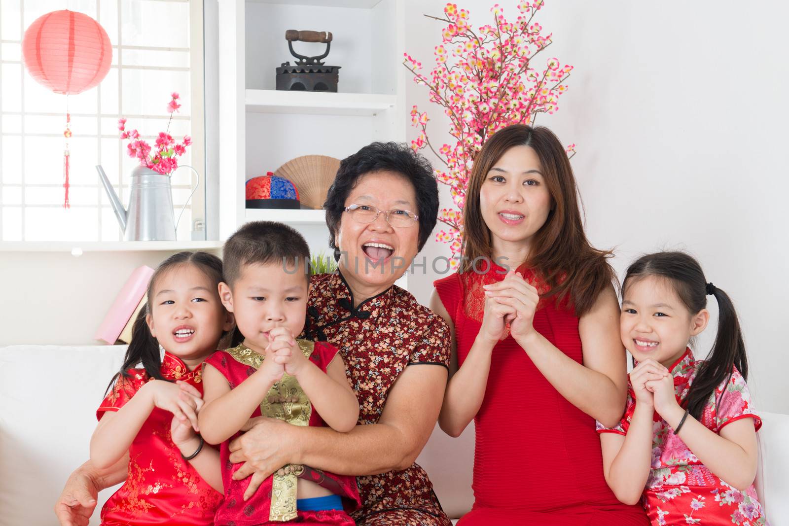  Happy Asian family reunion at home. by szefei
