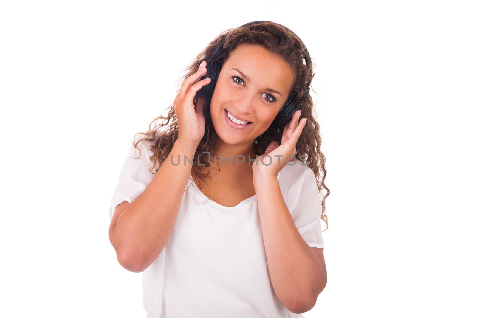 Woman listening to music with headphones isolated