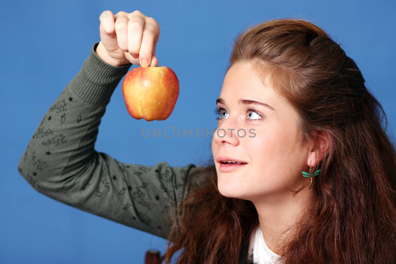 Beautiful young woman in blue background